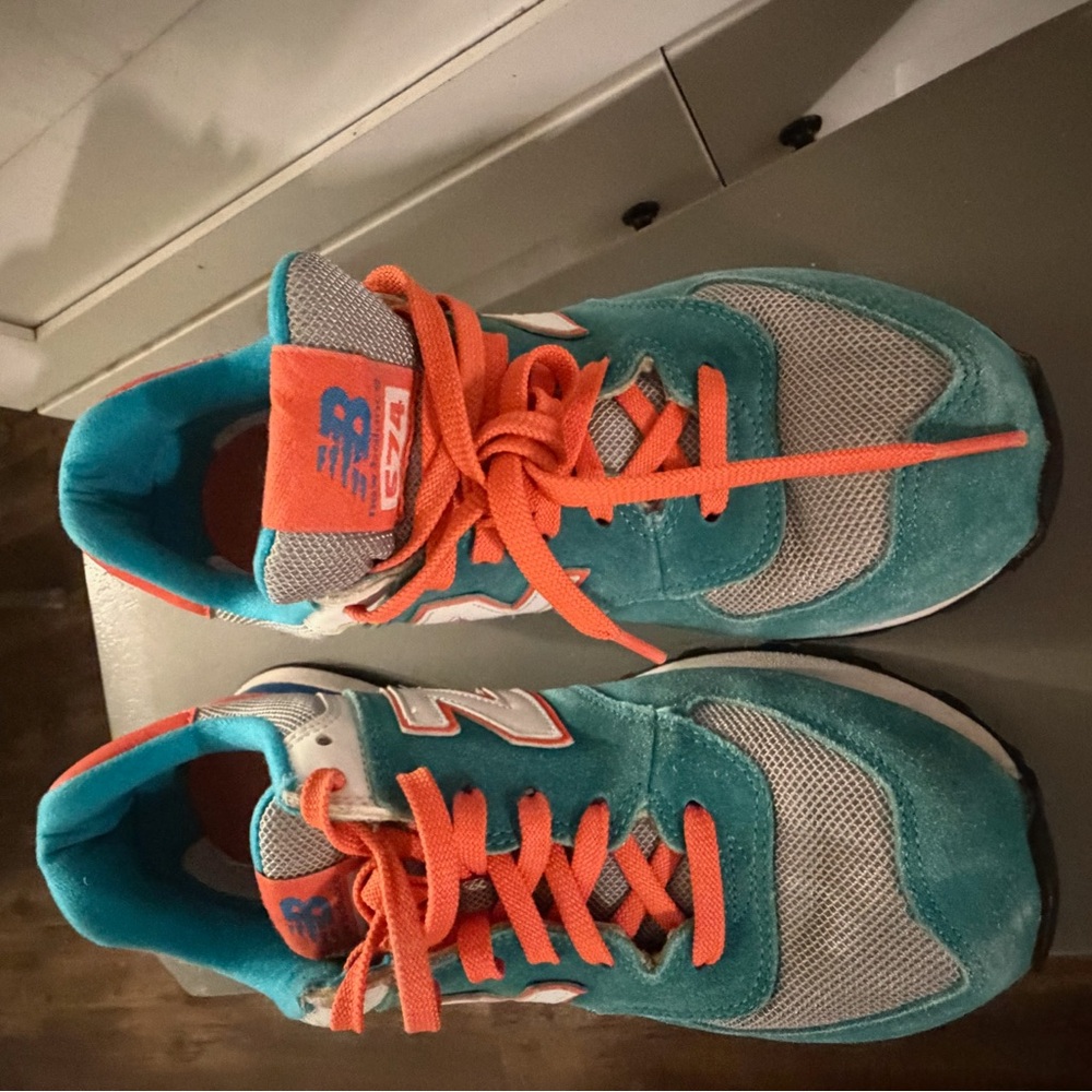 New Balance womens Teal with Orange Accent Sneakers